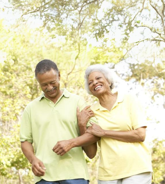 Clermont Park Senior Living Community in Denver, CO - senior couple walking in park