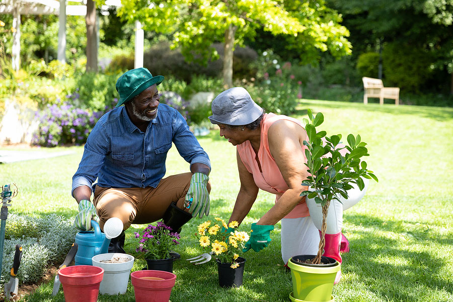 Clermont Park Senior Living Community in Denver, CO - gardening together