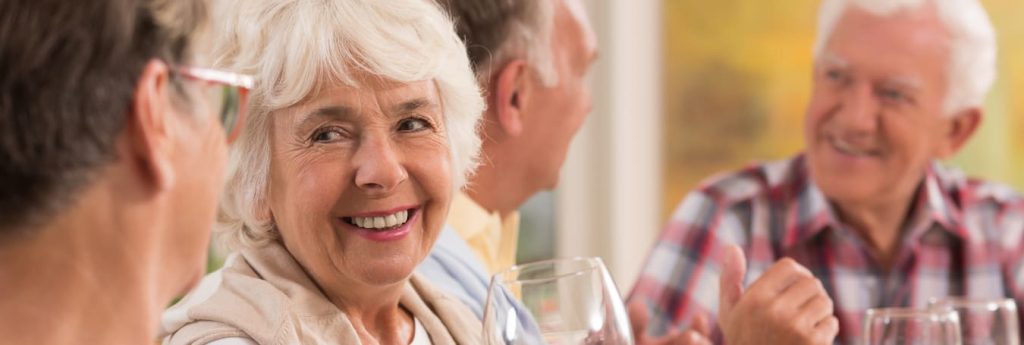 Clermont Park Senior Living Community in Denver, CO - residents enjoying dinner