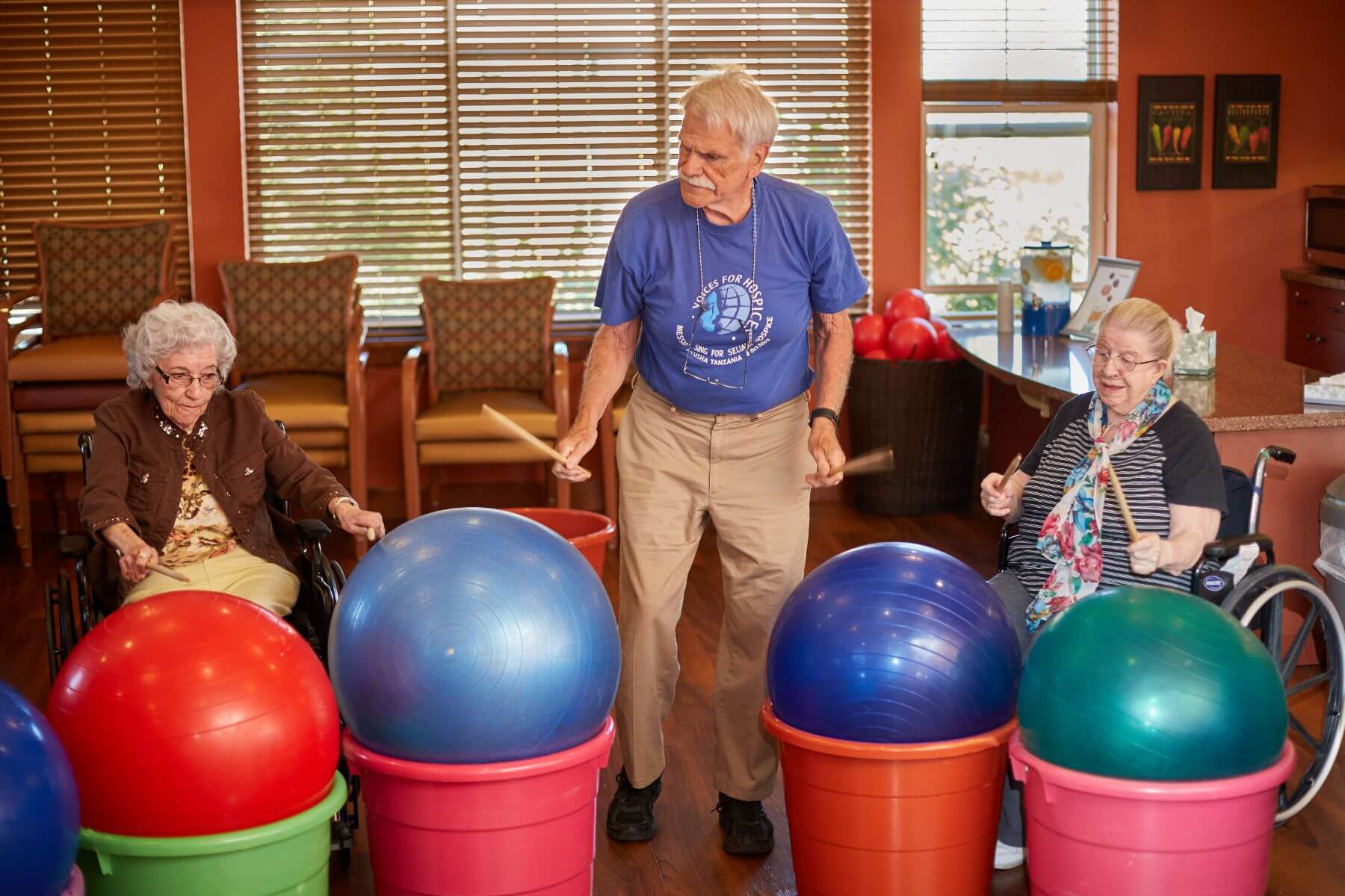 Clermont Park Senior Living Community in Denver, CO - older man leads drum circle class