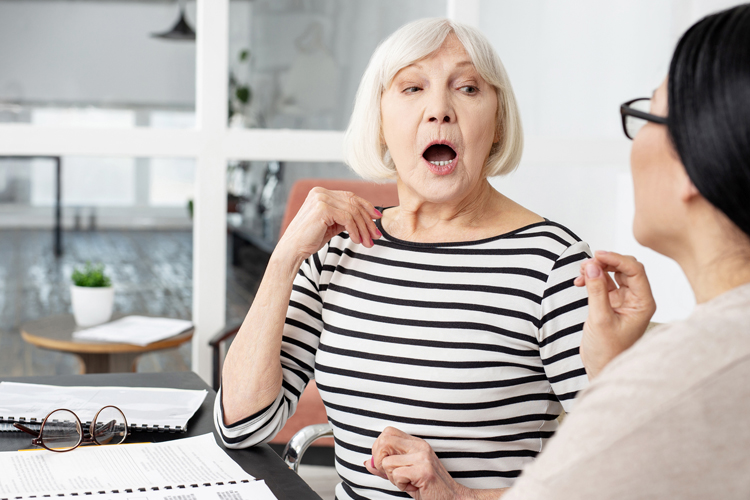Clermont Park Senior Living Community in Denver, CO - clermont park senior woman working with speech therapist