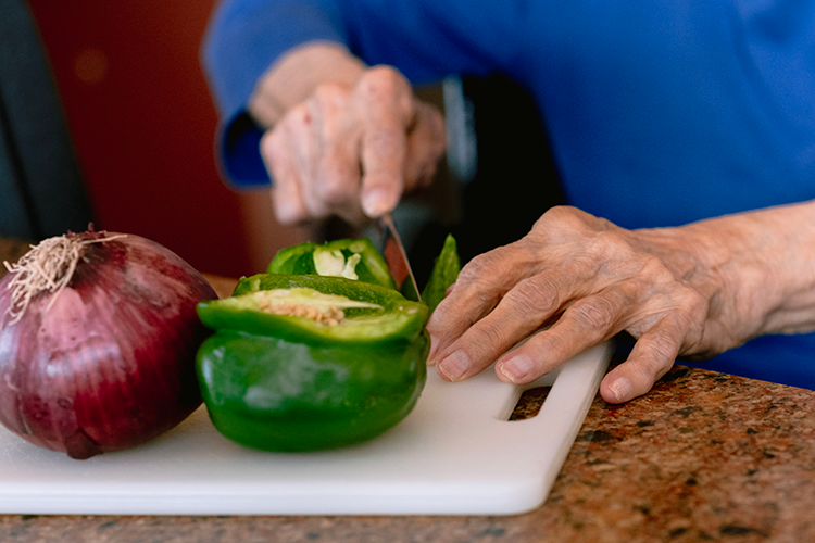 cooking with care closeup Clermont Park Senior Living Community in Denver, CO - cooking with care closeup